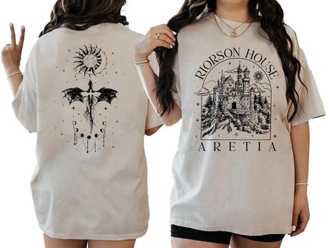 PRICES MAY VARY. AWESOME SHIRT: Dive into the mythical world of Aretia with this captivating T-shirt, featuring intricate designs inspired by the legendary riders and their formidable dragons. This Xaden Riorson House Aretia shirt is perfect for fans of fantasy adventures and dragon lore. DETAILS: 100% cotton. Antique colors & Sport Grey: 90/10 cotton/polyester. Ash Grey: 99/1 cotton/polyester. Medium fabric (5.3 oz/yd² (180 g/m²)) Product color may vary slightly due to photographic lighting sou Riorson House, Dragon Lore, Flame Dragon, Mythical World, Bookish Stuff, Fourth Wing, Book Clothes, Dragon Rider, Fantasy Adventure