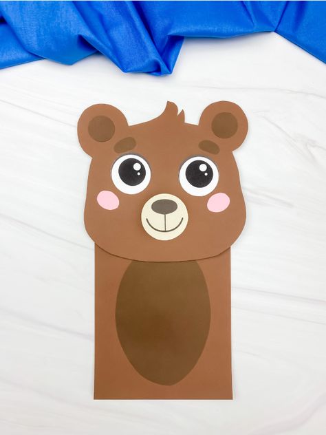 This Brown Bear paper bag puppet craft is a fun and easy way to make your own little brown bear. It's perfect for kids of all ages. You can use the template that comes with this project for easy fun! Download and make it with the kids today! Brown Bear Paper Bag Puppet, Bear Puppet Paper Bag, Teddy Bear Puppet, Bear Paper Bag Puppet, Bear Puppet Craft, Bear Paper Craft, Teddy Bear Craft, Paper Bag Puppet Craft, Bear Puppet