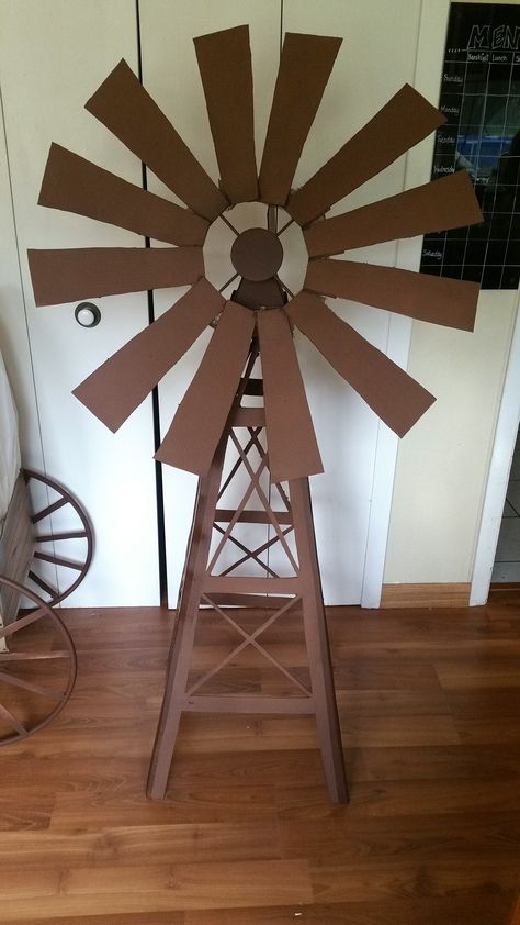 Windmill I made for kids camp. Cardboard, spray paint, cheese cloth (helped hold the blade pieces together) and HOT GLUE! Farm Vbs, Wooden Windmill, Cowboy Theme Party, Wild West Theme, Wild West Party, Farm Themed Birthday Party, Kids Camp, Made For Kids, Western Theme Party