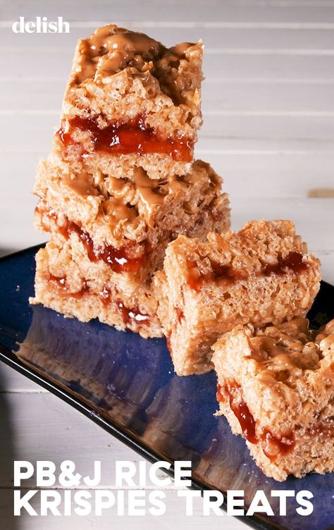 These PB&J Rice Krispie Treats Bring Us BackDelish Rice Krispy Sushi Rolls, Pbj Rice Krispy Treats, Pbj Rice Krispies, Pb&j Ideas, Pb&j Rice Krispie Treats, Peanut Butter And Jelly Rice Krispies, M&m Rice Crispy Treats, Pb Rice Krispie Treats, Gourmet Rice Krispie Treats