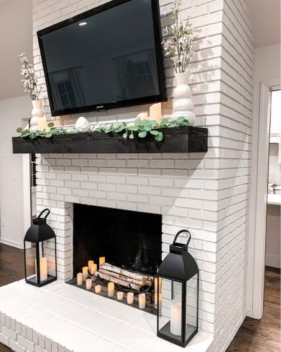 Living room farmhouse home decor  White fireplace Black lanterns  Remote control amazon candles Eucalyptus garland Spring home decor    http://liketk.it/2BWSl #liketkit @liketoknow.it #LTKunder50 #LTKunder100 #LTKstyletip #LTKspring #LTKsalealert #LTKhome #LTKfamily Neutral Farmhouse Living Room, Living Room Decor White, Room Decor White, Spring Home Decor Ideas, White Brick Fireplace, Neutral Farmhouse, Andong, Brick Fireplace Makeover, Farmhouse Living Room Decor