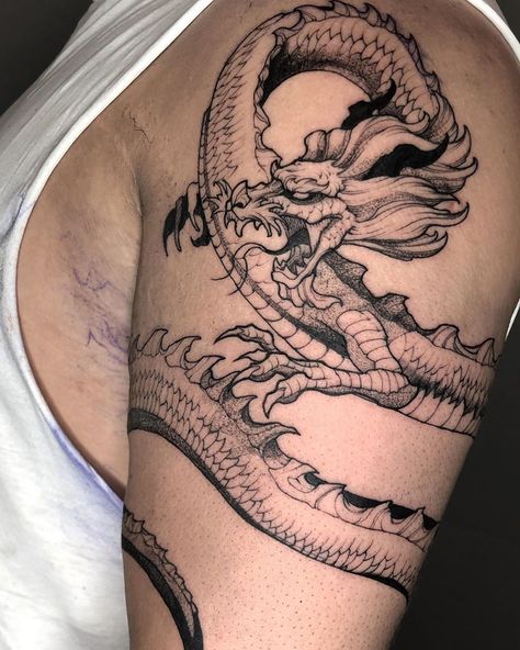 Mitchell Keanu | Blackbear Ink on Instagram: “Close up for Kaan’s Dragon wrap-around🔥 . . . . . . . . . . . . . . . . . . . #blackwork #blackworkers #blacktattooart…” Shenron Arm Sleeve Tattoo, Dueling Dragons Tattoo, Dragon Tattoo Inner Bicep, Wrap Around Neck Tattoo, Dragon Bicep Tattoo, Dragon Wrap Tattoo, Dragon Wrapped Around Leg Tattoo, Wrap Around Dragon Tattoo, Dragon Wrapped Around Arm Tattoo