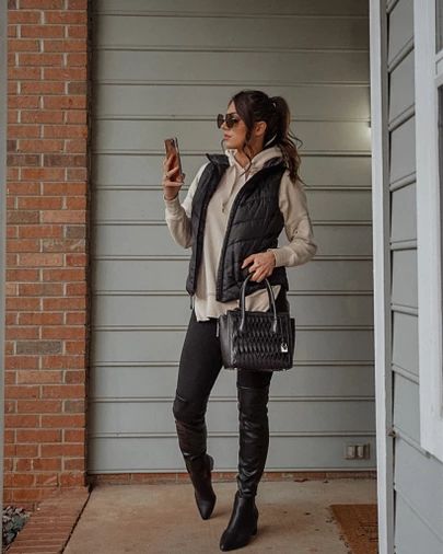 Perfect Sunday outfit for winter. 😍 can’t beat an oversized hoodie, black puffer vest, leggings, and over the knee boots. http://liketk.it/37fsp #liketkit @liketoknow.it Body Warmer Outfit Street Styles, Black Sherpa Vest Outfit, Black Puffy Vest Outfits For Women, Puffer Vest With Hoodie Outfit, Black Puffer Vest Outfits For Women, Black Puffy Vest Outfit, How To Style A Puffer Vest, Oversized Puffer Vest Outfit, Black Vest Outfits