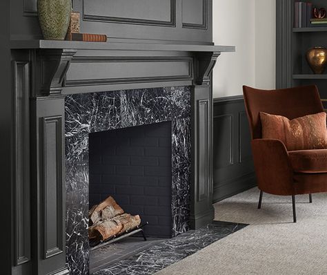 Iron Ore Mantle, Fireplace Trends For 2023, Tv Mantel Decorating Ideas, Mantle With Tv Decorating Ideas, Black Mantle Fireplace, Black Tile Fireplace, Painting Brick, Black Mantle, Fireplace Black