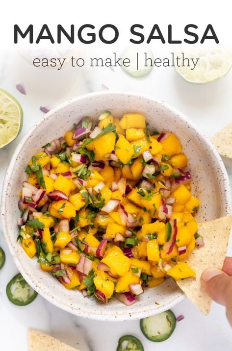 This Spicy Mango Salsa is a sweet and succulent side dish to add flair to any Mexican inspired dish. Easy to make, tasty, with just a little kick of spice! Goes perfect on top of fish, salmon. chicken - you name it! The BEST homemade recipe. Mexican Mango Salad, Mango Side Dish, Salmon Wellington Side Dishes, Salmon Sides Dishes, Sides For Fish, Mango Dishes, Easy Mango Salsa Recipe, Mexican Sides, Mango Salsa Recipe