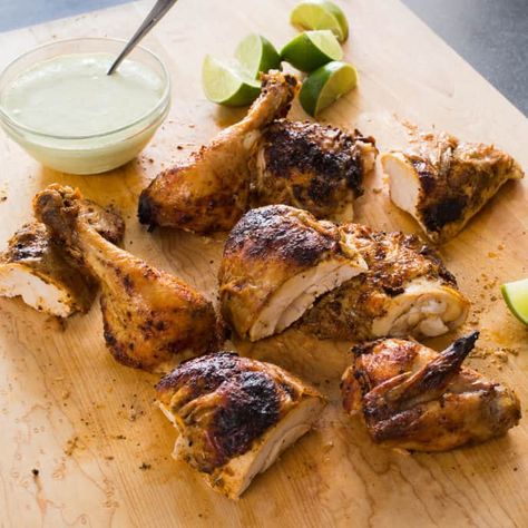 Peruvian Roast Chicken with Garlic and Lime | Cook's Illustrated Peri Peri Chicken Recipe, Portuguese Chicken, Feasting At Home, Peri Chicken, Peruvian Dishes, Peri Peri Chicken, Chicken And Potatoes, Baked Chicken Tenders, Lime Recipes