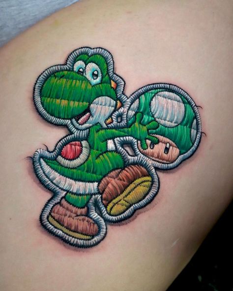 Yoshi Tattoos, Tatos Ideas, Yoshi Tattoo, Patch Tattoos, Embroidery Tattoos, Nintendo Tattoo, Patch Tattoo, Mario Tattoo, Embroidery Tattoo