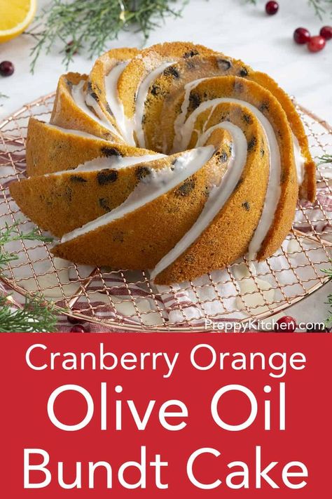 From Preppy Kitchen, this delicious orange cranberry olive oil bundt cake topped with citrus glaze has a moist crumb and fragrant aroma you'll fall in love with. perfect for any upcoming holiday! #oliveoilcake #oliveoilbundtcake #cranberryorangecake Olive Oil Bundt Cake, Moist Spice Cake, Citrus Glaze, Chocolate Olive Oil Cake, Orange Olive Oil Cake, Cranberry Orange Cake, Orange Olive Oil, Cake Bundt, Lemon Olive Oil Cake