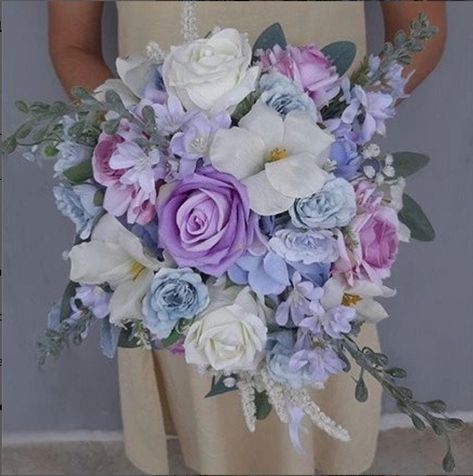 Our bouquets are made using the best quality silk flowers. They look and feel extremely real. Silk flowers bouquet are beautiful choices for those that would like to keep their bouquets for years to come as it will stay looking gorgeous forever:) This lilac, lavender and cream faux bridal bouquet is absolutely beautiful and lovely! Diameter 34cm height 34cm Here's a video on this faux bridal bouquet: https://www.tiktok.com/@2lovenhappiness/video/7121894935896411394?lang=en Some of the faux flowe Bouquet Of Flowers Lilac, Blue Purple White Wedding Bouquet, Blue Purple White Bouquet, Lavender And Periwinkle Wedding, Blue Purple And White Wedding Flowers, Lavender And Blue Wedding, Lavender Bridesmaid Bouquet, Purple Bouquet Wedding, Faux Bridal Bouquet