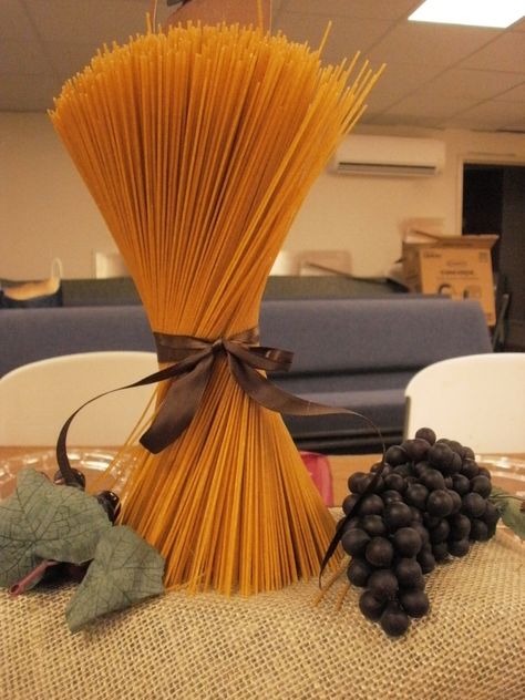 Pasta Centerpiece-Helpful TIP:make sure you glue down on round cardboard base to keep steady. Not edible.Grapes from Dollar Tree Italian Table Decorations, Italian Party Decorations, Italian Dinner Party Decorations, Italian Centerpieces, Bistro Decor, Italian Themed Parties, Decoration Buffet, Progressive Dinner, Italian Bistro