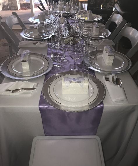 Lavender, white, and silver table setting! Lavender, White , and Silver Wedding! Lilac And Silver Wedding Decor, Lavender And Silver Centerpieces, Lilac White And Silver Party Decor, Silver Wedding Centerpieces Elegant, Lavender And Silver Party Decorations, Lavender White And Silver Party Decor, Purple And Silver Table Decorations, Purple And Silver Quinceanera Theme, Purple And Silver Table Setting