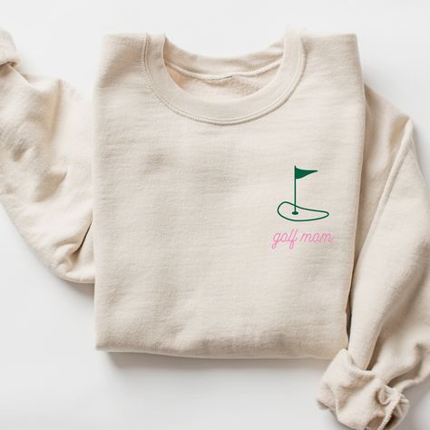 Golf Mom Sweatshirt I love to help my customers with custom orders, if you have a specific request (adding team or club name, bachelorette party personalization, a different sweatshirt color, design on a shirt, or a swap to a Comfort Colors sweatshirt), please message me and I will promptly get back to you! This is a Gildan Sweatshirt with a UNISEX FIT. Please review the size chart in the images before you place your order. If you have any questions about sizing, I would be happy to help! If you don't see the specific color that you are looking for, please message me and I will get back to you quickly. PRODUCTION and SHIPPING Production takes about 1-3 days and standard shipping is 3-5 business days. If you are in a rush, please message me and I can help with shipping upgrades. RETURNS & E Golf Team Shirts, Golf Sweatshirt, Slp Shirts, Golf Mom, Team Sweatshirts, Faith Clothing, Doctor Gift, Gildan Sweatshirt, Comfort Colors Sweatshirt