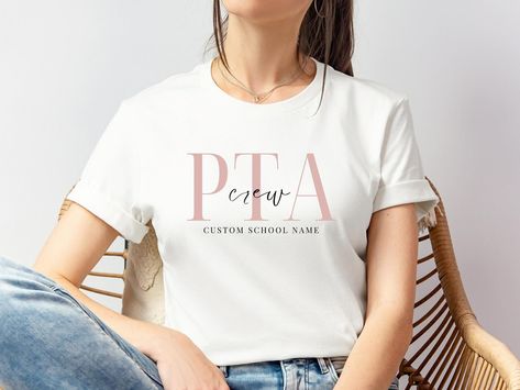 Show your school spirit with our stylish PTA and PTO shirts! Perfect for parents who are as dedicated to style as they are to school involvement. 🏫✨ LINK TO SHOP IN BIO 🔗‼️ 50% OFF WHOLE STORE 🏷️💯Customize with your school’s name and support your local programs in style! #PTAShirt #PTOShirt #SchoolSpirit #ParentTeacherAssociation #ParentTeacherOrganization #CustomSchoolGear #SupportSchools #SchoolPride #ParentInvolvement #EducationalSupport #CommunityStrong #LocalSchools #ParentLife #teachers... Pto Shirts, Pta Mom, Pta Shirts, Pta Events, Pta Moms, School Spirit Days, Spirit Days, Bold Letters, School Community