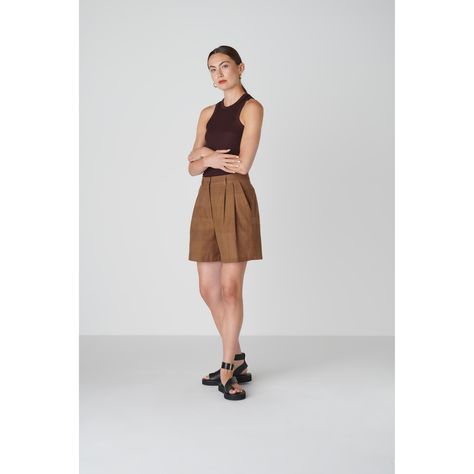 Want to look elegant and show a bit of leg? Discover the Bièl shorts in Cappuccino Brown. These shorts feature a high and slim fit at the waist, with a relaxed fit in the leg. They include a double pleat and two side pockets. The Bièl shorts are perfect for the warmer summer days, but also look stunning in the winter when paired with tights and boots. Complete your look with the matching June Jacket.  The fabric is a mix of organic and recycled cotton. The yarns are traditionally plant dyed with bark from trees in India and then handwoven into a beautiful fabric, giving it a natural look and ensuring its uniqueness. The production is carried out by a family-owned business in Portugal. The fabric of the Bièl Shorts is handwoven, plant dyed and made from 70% organic cotton, 30% recycled cott Brown Short Outfit, Brown Shorts Outfit, Beige Shirt, March Birthstone Jewelry, Tights And Boots, Brown Shorts, Gifts For New Mums, Pearl Jewellery Earrings, Fine Jewelry Gift