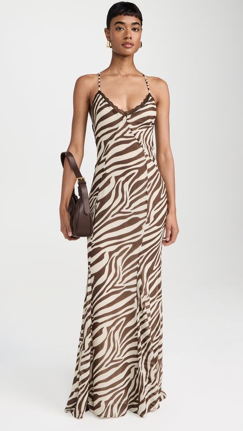 Find RUNAWAY THE LABEL Aminah Maxi Dress on Editorialist. The Aminah Maxi Dress by Runaway the Label is crafted from lightweight, non-stretch chiffon. It features adjustable crisscross shoulder straps, a V neckline, and lace trim. The dress has a zebra print and a hook-and-eye closure with a hidden zip at the back. It is fully lined and made of 100% polyester. The dress is hand wash only. The dress measures 60.75 inches in length from the shoulder in size XS. Vestidos Animal Print, Runaway The Label, Zebra Dress, Printed Robe, Festival Looks, Animal Print Dresses, Sweaters Knitwear, Printed Maxi, Brown Beige