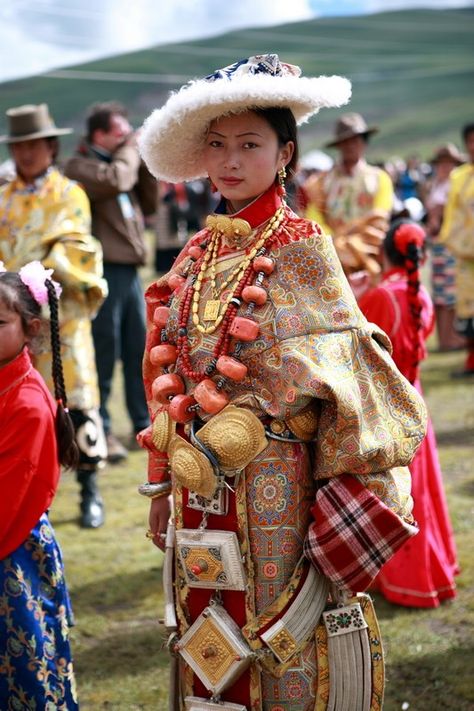 Litang Horse Festival, Tibet      Beautiful woman from the Litang area in traditional clothing. She wears a chuba and sheepskin hat, multiple huge and heavy prayer boxes and linking chains popular in Kham, and a spectacular necklace with enormous pieces of coral (this alone is probably worth tens of thousands of dollars). Tibetan Clothing, Tibetan People, Design Image, Traditional Fashion, Folk Costume, World Cultures, People Of The World, Traditional Dress, Traditional Clothing