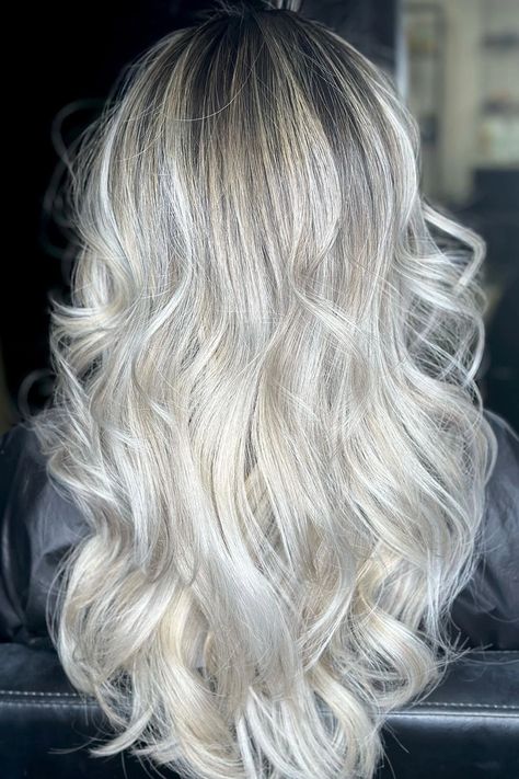 Woman with ice blonde highlights. Icy Blonde Hair With Lowlights, 2025 Hair Color, White Blonde Hair With Lowlights, Blonde Balayage Highlights On Dark Hair, Champagne Balayage, Balayage Highlights On Dark Hair, Winter Blonde Hair Balayage, Ice Blonde Balayage, Toned Blonde Hair