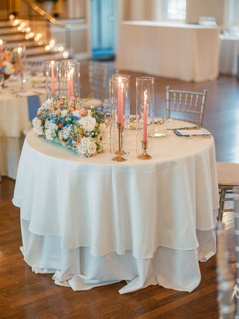 Spring wedding sweetheart table flowers. Taper candles at sweetheart table. Blush, light blue, white, peach sweetheart table flowers. Sweetheart Table Wedding Simple, Wedding Sweetheart Table Flowers, Sweetheart Table Flowers, Wedding Sweetheart Table, Bride Groom Table, Sweetheart Table Wedding, James Anderson, Cricket Club, Wedding Vibes