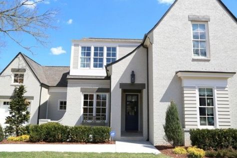 Sherwin-Williams,  body of the home is Amazing Gray SW 7044 in satin finish, the exterior trim/columns/trim are Shoji White SW 7042.  The cedar timber lintels above the windows are Porpoise SW 7046. Exclusive Invitation, Amazing Gray, Painted Brick Exteriors, Best Exterior Paint, Painted Brick House, Shoji White, Stucco Exterior, Exterior Renovation, Grey Exterior