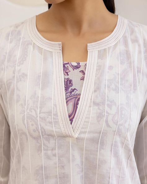 Summer 2024 - New arrivals! Unexpected styles with a youthful vibe... Experiment with layering in summer! This sheer, white pintuck kurta from our Paisley Layered Set makes maximum impact over a printed piece. Shop the look from ‘Lavender Paisleys’ on www.cottonsjaipur.com [ Cottons Jaipur, Cotton, Lavender, Paisley, Handmade Kurtas, Everyday-wear, Summer staples ] #cottons #cottonsjaipur #newarrivals #floral #summer #summer2024 #handcraftedkurtas #comfortfits #cottonsuitset #summertime #... Pintucks Kurti Designs, New Neck Designs, Jaipur Prints, Plus Size Fashion For Women Indian, Cottons Jaipur, Cotton Lavender, Salwar Neck Designs, Churidar Neck Designs, Indian Kurti Designs