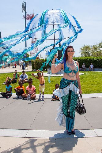 What a great idea! Similar to my own pants that I dear Mom made with added flair. SUPER!  Coney Island Mermaid Parade 2013 Mermaid Parade Coney Island, Mermaid Parade Float, Festival Umbrella, Kids Parade Floats, Jellyfish Umbrella, Under The Sea Costumes, Mermaid Float, Sea Costume, Parade Ideas