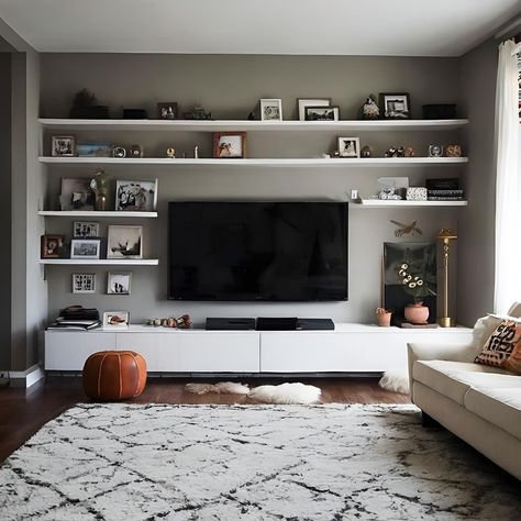 Movie Night Must-Have: A Functional and Stylish TV Wall! This TV wall is ready for your next movie marathon. The large screen takes center stage, while the spacious built-in cabinets offer plenty of storage for movies, games, and anything else you need for a fun night in. The floating shelf adds a touch of style for displaying decorative objects or memorabilia from your favorite films. What are your essential elements for creating the perfect movie-watching experience at home? Share your... Movie Shelf Ideas, Movie Shelf, Your Next Movie, Perfect Movie, Movie Watching, Art Shelves, Movie Marathon, Built In Cabinets, House Renovation