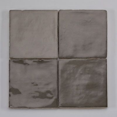 This Moroccan style of glazed tile, both in design and technique, dates back as far as the mid-10th century and is still just as popular today as artisans worldwide continue the art. Medici & Co. Color: Gray/Dark | Medici & Co. Zellige 4" x 4" Ceramic Subway Tile 4.0 H x 4.0 W x 0.38 D in gray / blackCeramic in Gray / Dark | 4" W X 4" L | Wayfair Tile Surround Bathtub, Moody Backsplash, Awesome Kitchens, Village Green, Ceramic Subway Tile, Black Fox, Art Color, Moroccan Style, Subway Tile