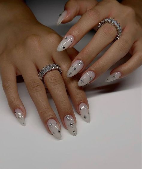 Star Nail Designs Simple, Celeb Nails Trends, Nail Art Designs New Years, Short Almond Nails With Rhinestones, Studded Nail Art, Silver Celestial Nails, 2024 Almond Nails, Almond Bday Nails, Nails With Small Gems