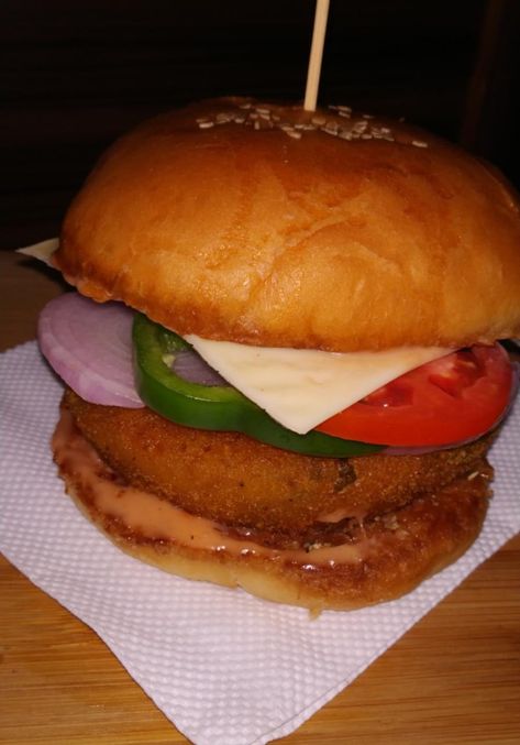 This recipe is very easy to make yet very tasty. This veg burger is having a crispy aloo tikki, cheese slice, sliced tomato,onion & capsicum. Please watch full recipe on my youtube channel,  {Click on the link}. Burger Snap, Aloo Tikki Burger Recipe, Veg Burger Recipe, Aloo Tikki Burger, Veg Burgers Recipe, Crispy Veg, Veg Cutlet, Veg Burger, Aloo Tikki