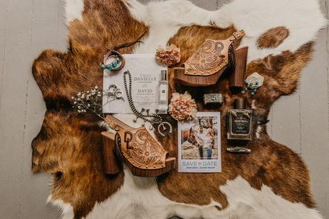 Cowhide Backdrop Wedding, Western Detail Shots, Western Wedding Detail Shots, Cowhide Wedding Decor, Western Wedding Ideas Decorations, Western Glam Wedding, Cowhide Wedding, Western Weddings, Western Wedding Invitations