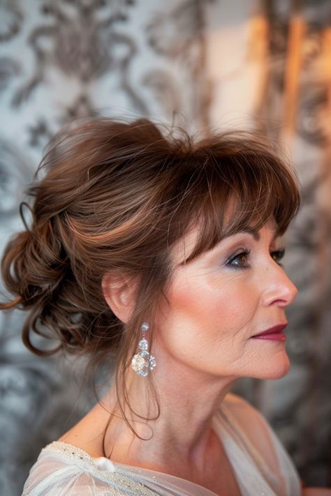 Say hello to the hair revolution where bangs are the banner of beauty at any stage of life. These 10 hairstyles are a testament to the allure that comes with embracing your age. They're not just hairdos; they're a celebration of every story your years have told. Tap the link for more style inspiration! Mother Of The Groom Hairstyles With Bangs, Updo Hairstyle With Bangs, Wedding Hair Styles With Bangs, Wedding Updo With Bangs, Formal Hair With Bangs, Updo With Bang, Updos With Bangs, Bold Bangs, Mob Hair