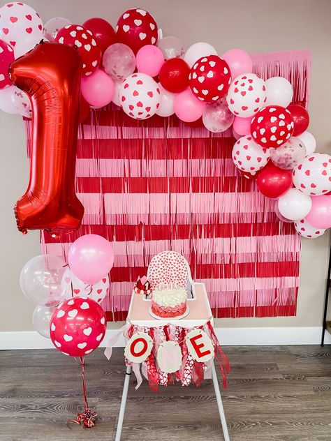 Feb First Birthday Ideas, One Year Old Valentine Birthday Party, Valentine’s Day First Birthday Cake, Valentine Birthday Decorations, Love Theme First Birthday, Heart Warrior First Birthday Party, Valentines First Birthday Photo Shoot, First Birthday Themes Valentines, February Themed Birthday Party