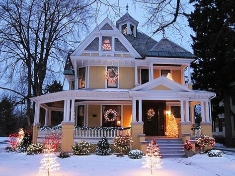 Complement pure, white snow with warm hues and bright lights for the holidays. Yellow House, Wrap Around Porch, Interior Modern, Victorian Christmas, House Goals, Christmas House, Style At Home, Pretty House, Home Fashion