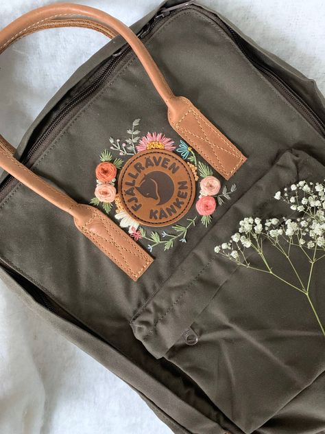 The Kanken No. 2 in Dark Olive has quickly become our favorite! More up on #etsy very soon! (tomorrow) -we certainly have spare time now! https://etsy.me/3bqcCd5  #kanken #kankenbackpack #no2 #embroidered #afteraugustco #etsyshop #custom #new #handmade #embroidery Broderie Anglaise Fabric, Embroidery Stitching, Unique Embroidery, Pola Sulam, Embroidery On Clothes, Cute Embroidery, Simple Embroidery, 자수 디자인, Sewing Embroidery Designs