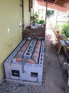 Old Wood Stove, Greenhouse Winter, Greenhouse Heaters, Mass Heater, Rocket Mass Heater, Greenhouse Design, Heating A Greenhouse, Small Greenhouse, Permaculture Design