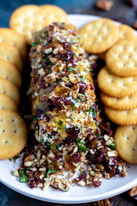 Make this Pecan Cranberry Goat Cheese Appetizer Recipe in minutes with just a few simple ingredients. A goat cheese log will stand out at holiday feasts or parties. #goatcheeserecipes #appetizerrecipes #easyappetizerrecipes #holidayrecipes #cheeserecipes #partyrecipes Goat Cheese Recipes Appetizers, Gourmet Thanksgiving, Cheese Log Recipes, Cranberry Goat Cheese, Goat Cheese Log, Cheese Logs, Honey Buzzard, Thanksgiving Board, Cheese Recipes Appetizers