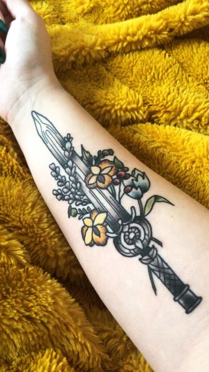 210+ Best Sword Tattoo Designs With Meanings (2023) - TattoosBoyGirl Dawnbreaker Skyrim Tattoo, Dawnbreaker Skyrim, Dawnbreaker Tattoo, Skyrim Tattoo Ideas, Elder Scrolls Tattoo, Tattoo Fire, Skyrim Tattoo, Elder Scrolls V Skyrim, Dagger Tattoo