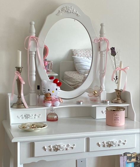 coquette aesthetic vanity with pink ribbon and candles and perfume and hello kitty and jewelry room aesthetic cute pink coquette white vanity Vanity Coquette, Aesthetic Vanity, Vanity Aesthetic, Jewelry Room, Feminine Room, Bedroom Vanity Set, Coquette White, Coquette Room, Casa Vintage