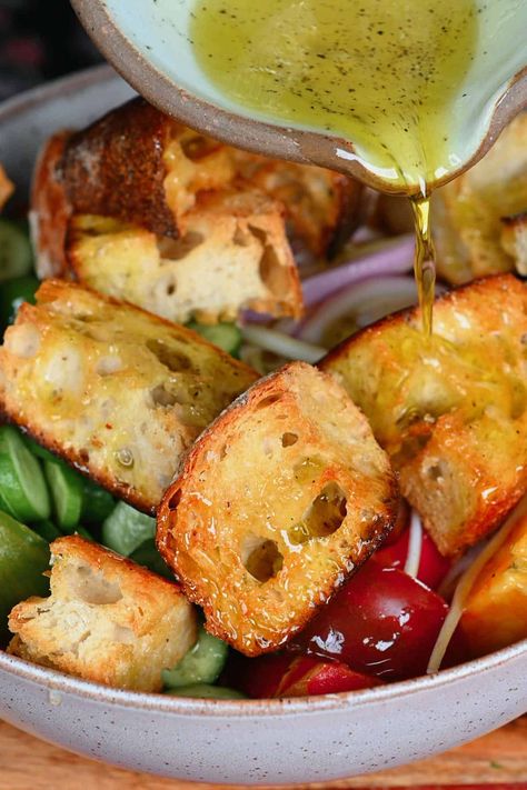 This Panzanella Salad (aka Tuscan-style tomato and bread salad) combines red onions, cucumber, and tomatoes with hearty toasted bread in a simple salad dressing for a delicious and nutritious summery salad! All you need is 8 ingredients and 25 minutes to prepare this simple, flavor-packed Italian bread salad!