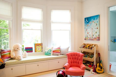 Kid's playroom features built-in window seat in bay window next to slanted toy bins on colorful striped rug Playroom Window, Bay Window Bedroom, Bay Window Decor, Bay Window Design, Bay Window Living Room, Built In Window Seat, Art Haus, Bay Window Seat, Window Seat Storage