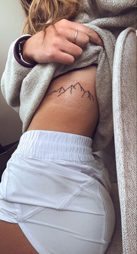 Western Tattoo Inspiration, Tattoo Ideas Female Sleeve Minimalist, Women’s Nature Tattoos, Mountain Tattoos For Women Ribs, Simplistic Western Tattoos, Deer Antler Spine Tattoo, Cute Tattoos Country, Cool Mountain Tattoos, Simple Above Knee Tattoos Women