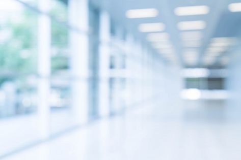 Blurred abstract background interior view looking out toward to empty office lobby and entrance doors and glass curtain wall with frame Photo | Free Download Ceo Headshots, Wooden Floor Pattern, Herringbone Wooden Floors, Backdrop Office, White Wooden Chairs, Empty Rooms Interior, White Square Tiles, Burgundy Walls, Dark Grey Walls