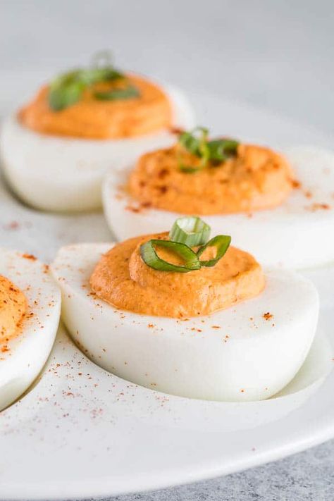 Roasted red pepper deviled eggs with ultra-smooth, creamy filling. The classic deviled egg recipe with big bold flavors and a spicy kick! #roastedredpepper #deviledeggs #easyappetizer Deviled Eggs Sweet, Deviled Eggs Recipe Classic, Avocado Deviled Eggs, Deviled Eggs Easy, Best Deviled Eggs, Bacon Deviled Eggs, Deviled Eggs Classic, Deviled Eggs Recipe, Deviled Egg