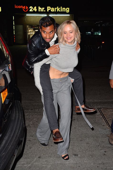 New rule of thumb: If J-Law can pull off an outfit while giving Aziz Ansari a piggyback ride, it must be wearable for us mere mortals. Thus, we're all about a turtleneck crop top and gray wide-leg trousers as the season transitions.   - MarieClaire.com Jennifer Lawrence Street Style, Aziz Ansari, Jennifer Lawrence Photos, Amy Schumer, Turtle Neck Crop Top, New Friendship, Teen Vogue, Saturday Night Live, Real Girls