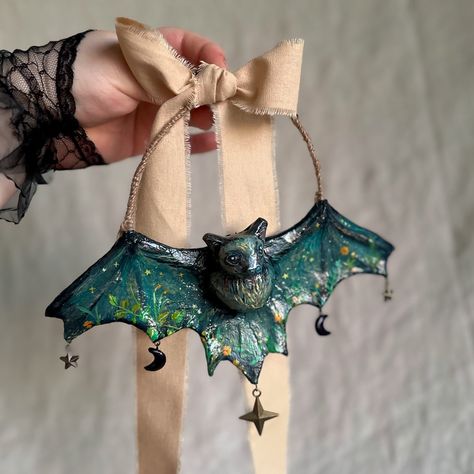 The bats have arrived! 🦇🖤🌺🌙 Now available on Etsy (link in bio). Add a dash of spooky elegance to your Halloween decor or a touch of whimsy to your Holiday tree with handmade bat ornaments! Both winged darlings are made from Vtg. French book pages, the wings are delicately painted with enchanting flowers or stars (incl. sculpture) making them lovely Halloween or year-round decor. 🦇 Bats are not only spooky but also vital to our ecosystem. Many species are essential pollinators, helping plan... Diy Corn Husk Bat, Diy Corn Husk, Bat Ornaments, Sculpture Making, Corn Husk, French Books, Round Decor, Holiday Tree, Ecosystem