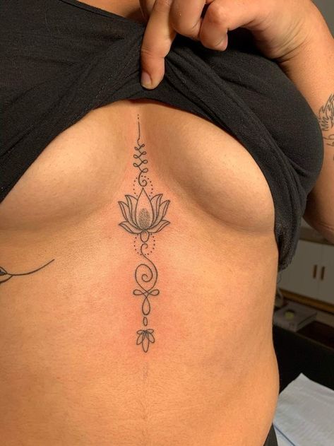 Chest Tattoos For Women Unique, Tatoos Between The Chest, Tattoo Ideas Female Symbols, Tattoo Ideas Female Middle Of Chest, Tattoo On Groin, Inbetween Breast Tattoo Ideas, Inner Chest Tattoos For Women, Female Sternum Tattoo Ideas, Side Stomach Tattoos Women Small