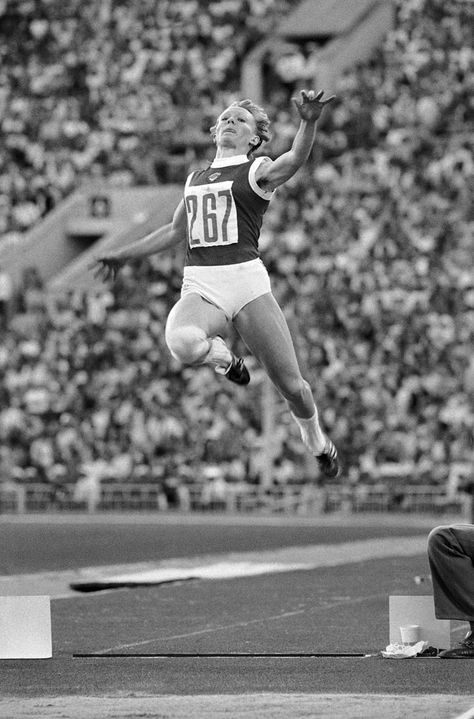 Russia’s Tatyana Kolpakova reaches 7.06 metres in the long jump, setting a new Olympic record and winning gold in 1980. Photograph by AP. Hammer Throw, Sport Videos, Triple Jump, Shot Put, Pole Vault, Long Jump, Olympic Athletes, Olympic Sports, High Jump