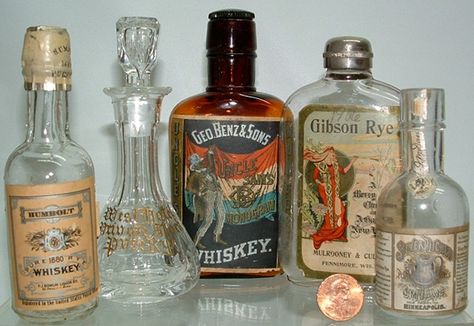 1920s Alcohol, Antique Liquor Bottles, Glass Bottle Candles, Old Liquor Bottles, Red Wing Stoneware, Flower Displays, Old Glass Bottles, Comic Book Layout, Antique Bottle