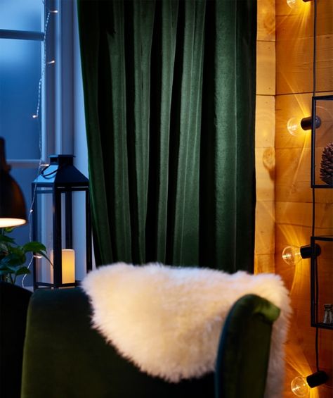 Dark green cotton curtains are pulled aside to reveal a window adorned with string lights Statement Curtains, Tromso Norway, Thick Curtains, Ikea Curtains, Welcome Winter, Green Curtains, Layered Rugs, Darkening Curtains, Tromso