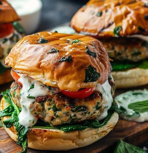 Amazing Sun-Dried Tomato and Feta Spinach Burgers with Tzatziki Sauce | Ridley's Wreckage | NewsBreak Original Feta Burger, Spinach Burgers, Southern Squash Casserole, Tomato And Feta, Broccoli Cauliflower Salad, Burger Night, Crispy Cheese, Greek Flavors, Parmesan Crusted Chicken